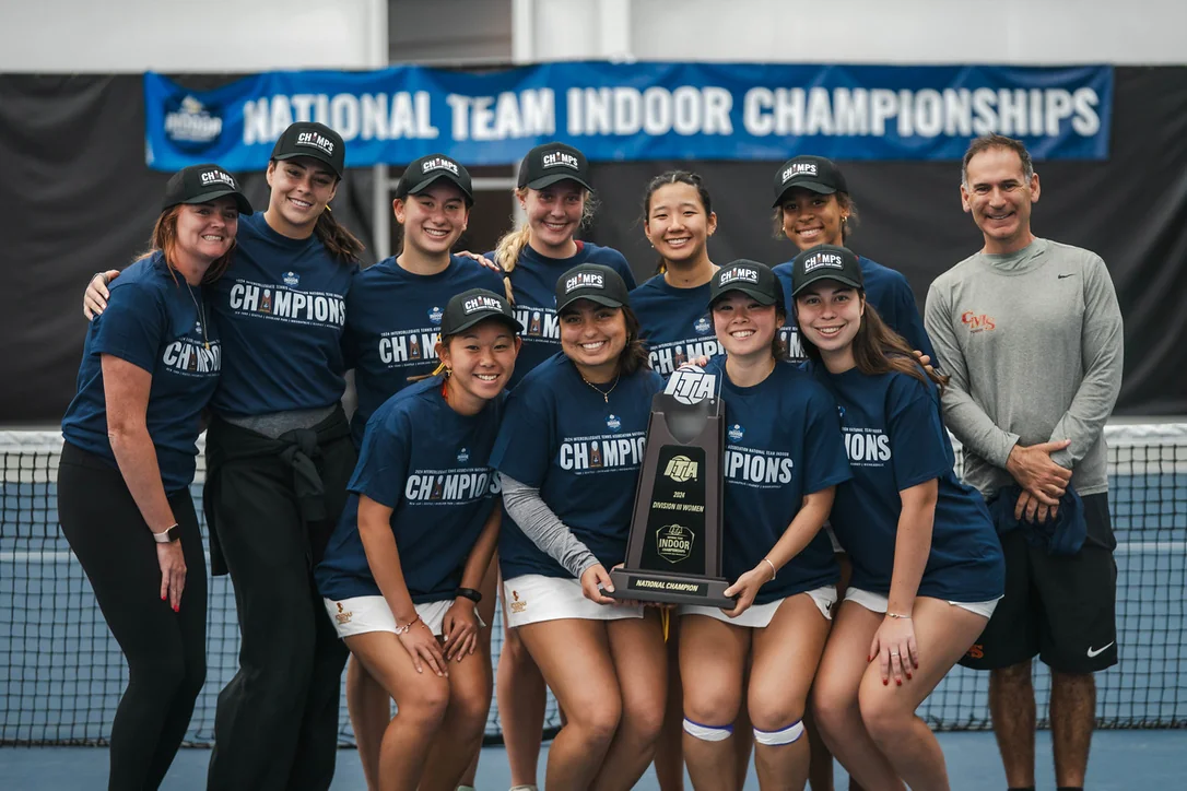 Dave Schwarz celebrating the 2024 ITA Indoor Championship with the CMS Athenas